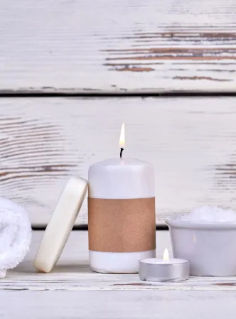 Spa concept. Terry towel with candle and salt.